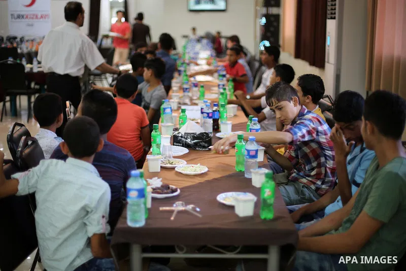 Palestinian orphan children break their fast during the holy fasting month of Ramadan in Gaza city on June 22, 2016. Ramadan is sacred to Muslims because it is during that month that tradition says the Koran was revealed...