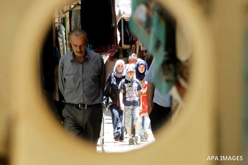 Palestinians shop at market on the holy month of Ramadan at market in the Old City of the West Bank town of Hebron on June 22, 2016. Ramadan is sacred to Muslims because it is during that month that tradition says the Ko...