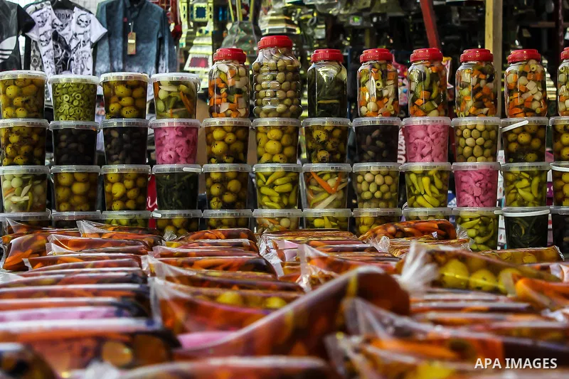 An Egyptian vendor sells pickles at a street market on the holy month of Ramadan, in the Cairo, Egypt, on June 23, 2016. Ramadan is sacred to Muslims because it is during that month that tradition says the Koran was reve...