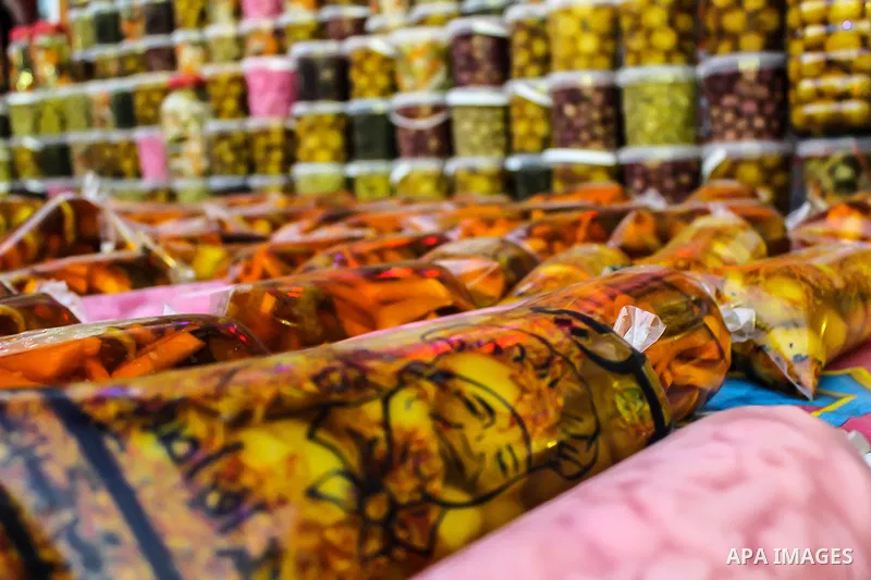 An Egyptian vendor sells pickles at a street market on the holy month of Ramadan, in the Cairo, Egypt, on June 23, 2016. Ramadan is sacred to Muslims because it is during that month that tradition says the Koran was reve...