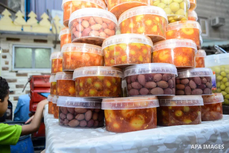 An Egyptian vendor sells pickles at a street market on the holy month of Ramadan, in the Cairo, Egypt, on June 23, 2016. Ramadan is sacred to Muslims because it is during that month that tradition says the Koran was reve...