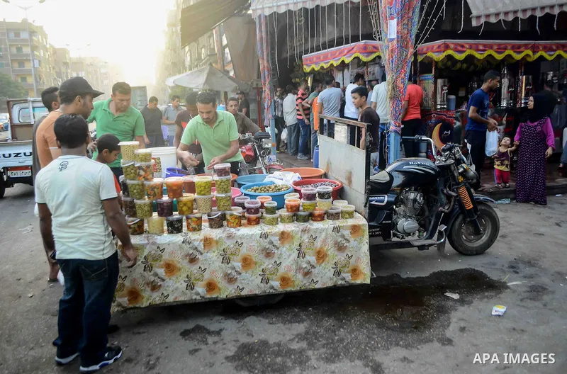 An Egyptian vendor sells pickles at a street market on the holy month of Ramadan, in the Cairo, Egypt, on June 23, 2016. Ramadan is sacred to Muslims because it is during that month that tradition says the Koran was reve...