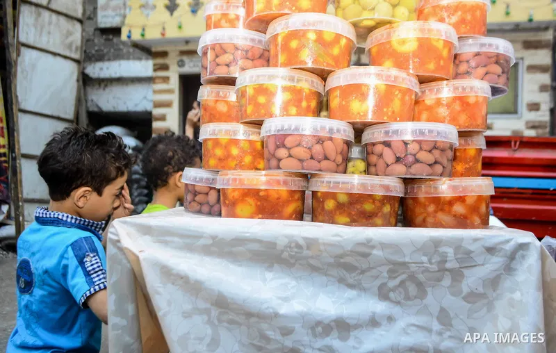 An Egyptian vendor sells pickles at a street market on the holy month of Ramadan, in the Cairo, Egypt, on June 23, 2016. Ramadan is sacred to Muslims because it is during that month that tradition says the Koran was reve...