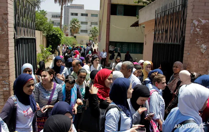 Egyptian students walk outside their school following a high school exams in Cairo, Egypt, June 23, 2016. From June 5 till 28, some 560,000 Egyptian students have to pass these exams which lead to the Egyptian General Se...