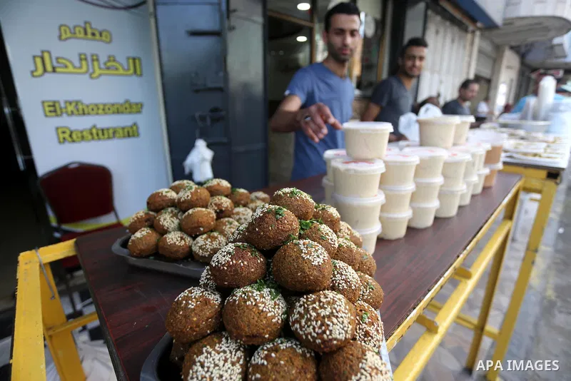 Palestinians prepare chickpeas known as Falafel for breakfasting during the holy fasting month of Ramadan in Gaza city, on June 23, 2016. Muslims around the world refrain from eating, drinking and sexual intercourse from...