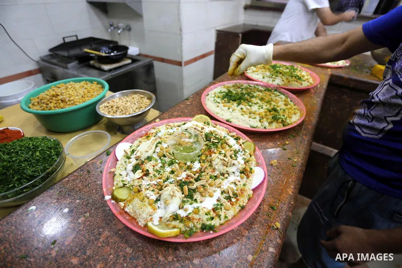 Palestinians prepare chickpeas known as hummus for breakfasting during the holy fasting month of Ramadan in Gaza city, on June 23, 2016. Muslims around the world refrain from eating, drinking and sexual intercourse from...