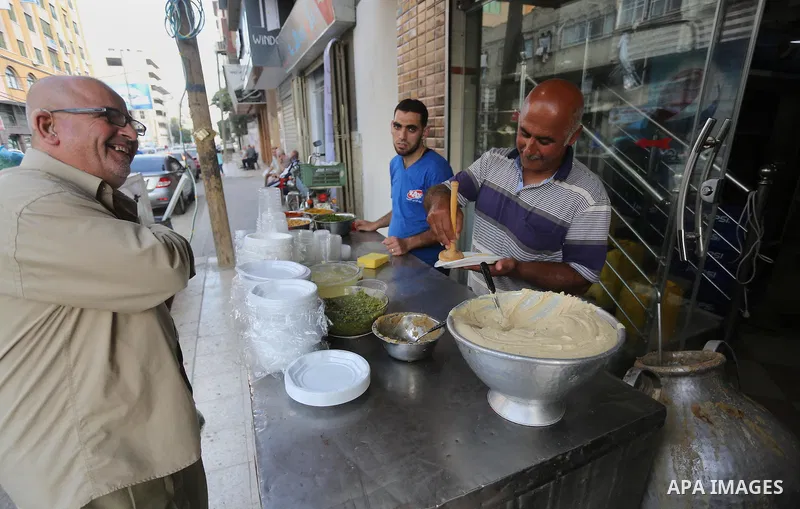 Palestinians prepare chickpeas known as hummus for breakfasting during the holy fasting month of Ramadan in Gaza city, on June 23, 2016. Muslims around the world refrain from eating, drinking and sexual intercourse from...
