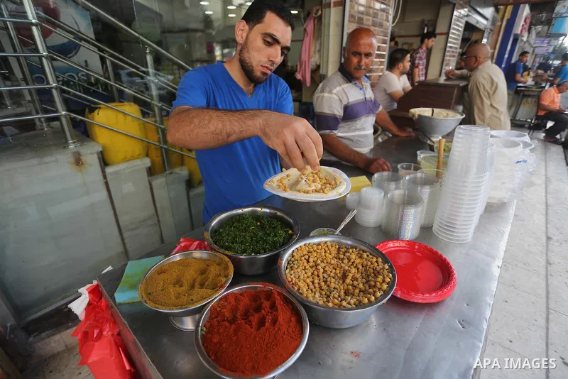 Palestinians prepare chickpeas known as hummus for breakfasting during the holy fasting month of Ramadan in Gaza city, on June 23, 2016. Muslims around the world refrain from eating, drinking and sexual intercourse from...