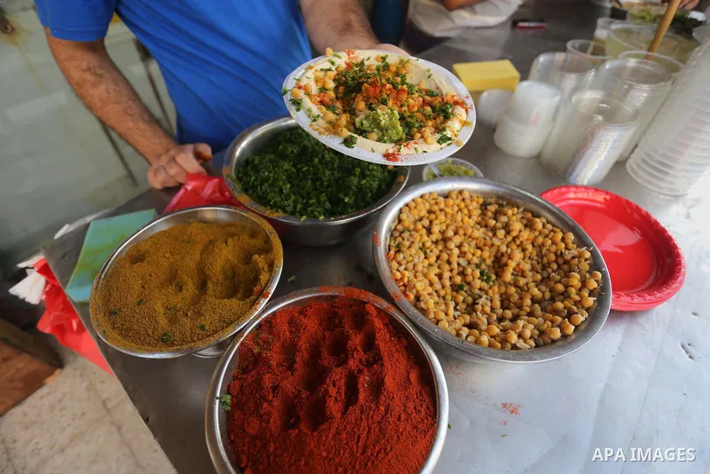 Palestinians prepare chickpeas known as hummus for breakfasting during the holy fasting month of Ramadan in Gaza city, on June 23, 2016. Muslims around the world refrain from eating, drinking and sexual intercourse from...