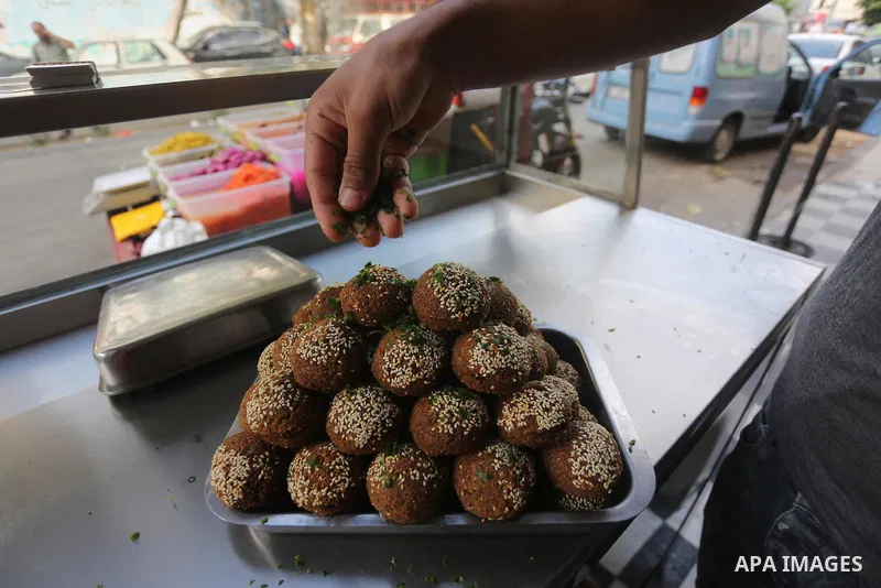 Palestinians prepare chickpeas known as Falafel for breakfasting during the holy fasting month of Ramadan in Gaza city, on June 23, 2016. Muslims around the world refrain from eating, drinking and sexual intercourse from...
