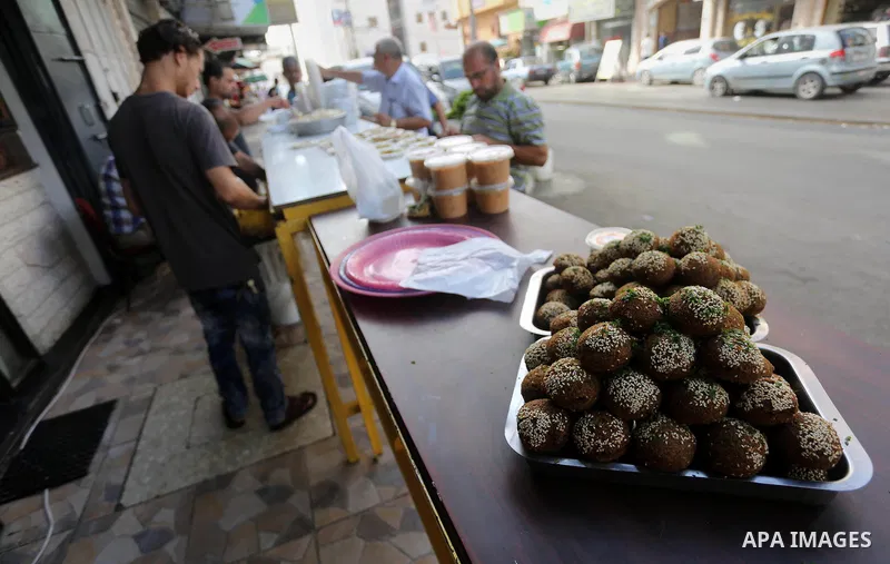 Palestinians prepare chickpeas known as Falafel for breakfasting during the holy fasting month of Ramadan in Gaza city, on June 23, 2016. Muslims around the world refrain from eating, drinking and sexual intercourse from...