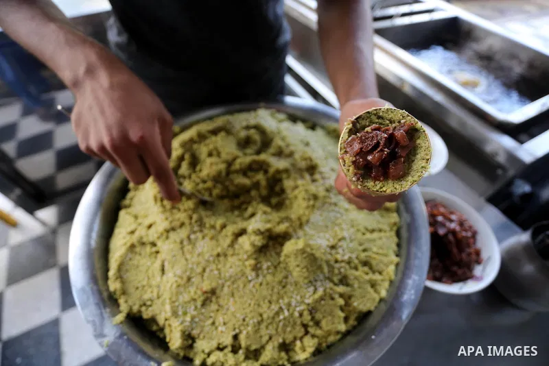 Palestinians prepare chickpeas known as Falafel for breakfasting during the holy fasting month of Ramadan in Gaza city, on June 23, 2016. Muslims around the world refrain from eating, drinking and sexual intercourse from...