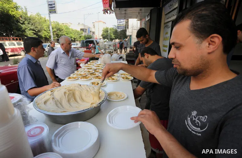 Palestinians prepare chickpeas known as hummus for breakfasting during the holy fasting month of Ramadan in Gaza city, on June 23, 2016. Muslims around the world refrain from eating, drinking and sexual intercourse from...