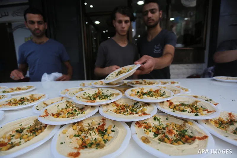 Palestinians prepare chickpeas known as hummus for breakfasting during the holy fasting month of Ramadan in Gaza city, on June 23, 2016. Muslims around the world refrain from eating, drinking and sexual intercourse from...