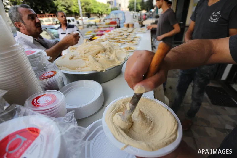 Palestinians prepare chickpeas known as hummus for breakfasting during the holy fasting month of Ramadan in Gaza city, on June 23, 2016. Muslims around the world refrain from eating, drinking and sexual intercourse from...