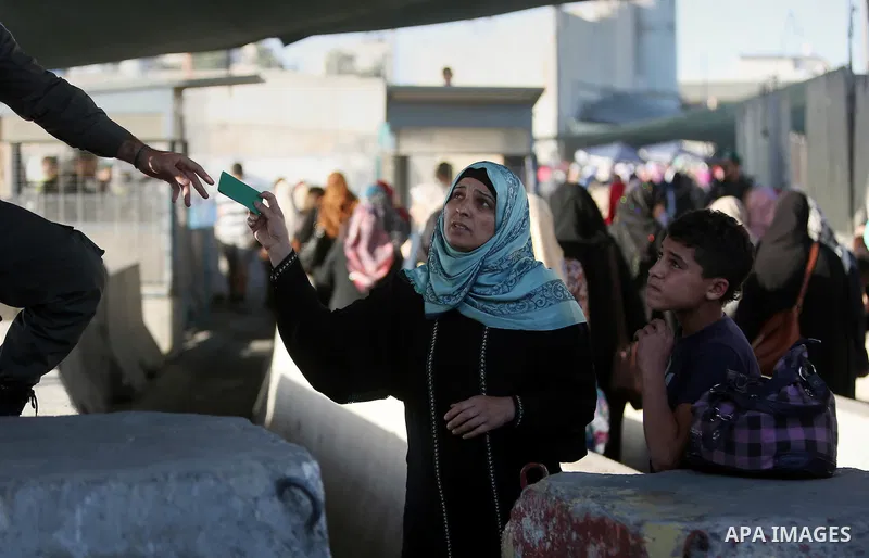 Palestinians walk past Qalandia checkpoint between the West Bank city of Ramallah and Jerusalem on June 24, 2016, as they head to Jerusalem's Al-Aqsa mosque for the third Friday prayer of the holy Muslim fasting month of...