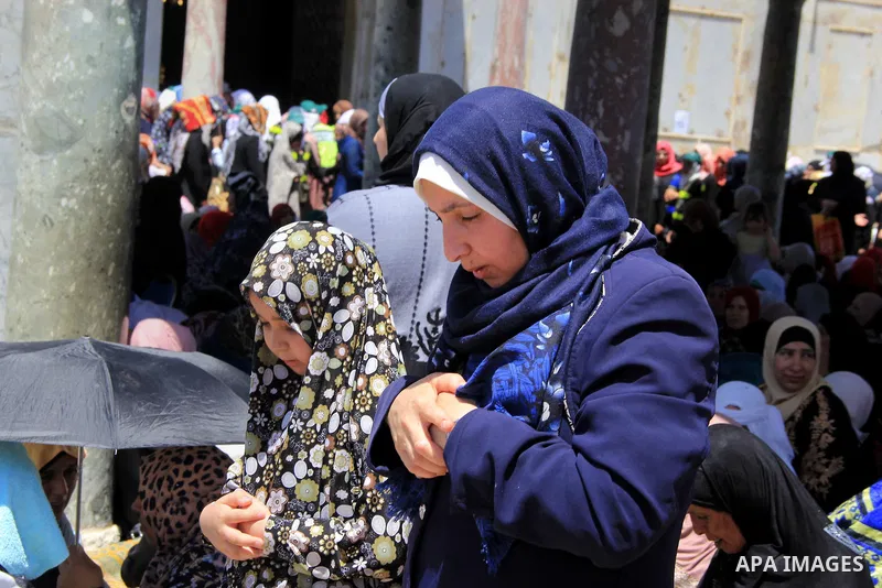 Palestinian Muslim worshippers perform Friday prayer in front of the Dome of the Rock mosque at the al-Aqsa mosque compound in Jerusalem's old city on June 24, 2016 during the holy fasting month of Ramadan. Photo by Mahf...