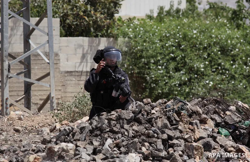 Israeli security forces advance during clashes with Palestinian protesters following a demonstration against the expropriation of Palestinian land by Israel on June 24, 2016 in the village of Kfar Qaddum, near Nablus, in...