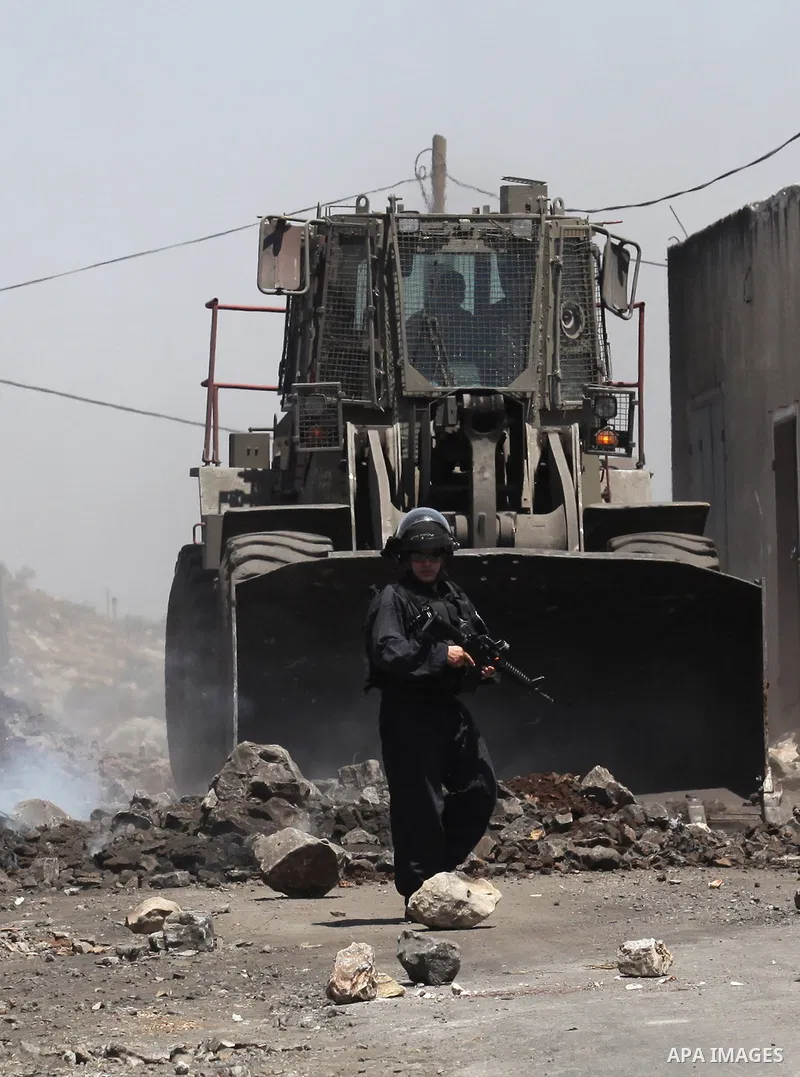 Israeli security forces advance during clashes with Palestinian protesters following a demonstration against the expropriation of Palestinian land by Israel on June 24, 2016 in the village of Kfar Qaddum, near Nablus, in...