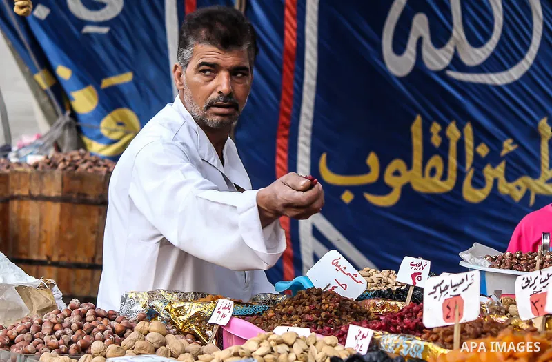 Egyptians shop at a market on the holy month of Ramadan in Cairo, Egypt, on June 24,2016. Muslims around the world refrain from eating, drinking and sexual intercourse from dawn till dusk during Ramadan, the holiest mont...