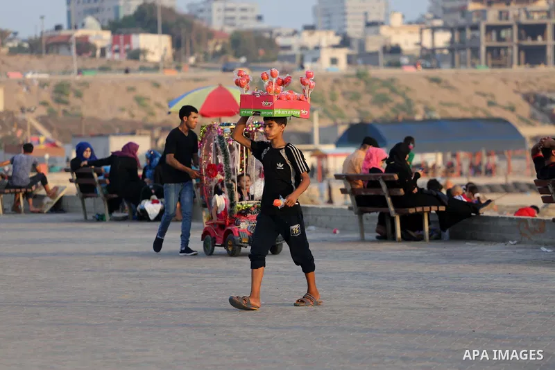 Palestinian muslims prepare to break their fast on the holy fasting month of Ramadan at the beach of the Mediterranean sea on the coast of Gaza city during a hot day, on June 24, 2016. Ramadan is sacred to Muslims becaus...