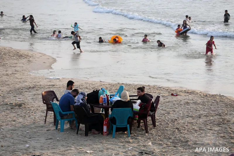 Palestinian muslims prepare to break their fast on the holy fasting month of Ramadan at the beach of the Mediterranean sea on the coast of Gaza city during a hot day, on June 24, 2016. Ramadan is sacred to Muslims becaus...