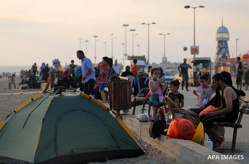 Palestinian muslims prepare to break their fast on the holy fasting month of Ramadan at the beach of the Mediterranean sea on the coast of Gaza city during a hot day, on June 24, 2016. Ramadan is sacred to Muslims becaus...