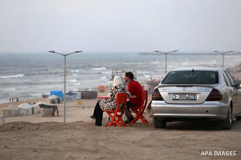 Palestinian muslims prepare to break their fast on the holy fasting month of Ramadan at the beach of the Mediterranean sea on the coast of Gaza city during a hot day, on June 24, 2016. Ramadan is sacred to Muslims becaus...