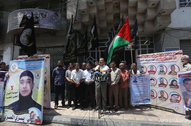 Palestinians take part in a protest demanding release the prisoners in Israeli jails, in Gaza city, on June 26, 2016. Photo by Mohammed Asad
