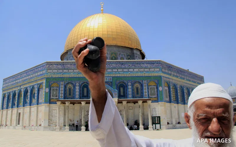 A Palestinian man shows foam-tipped bullets reportedly used by Israeli riot police outside the Dome of the Rock in Jerusalem's Al-Aqsa mosque compound after clashes erupted at the compound between Palestinians and Israel...