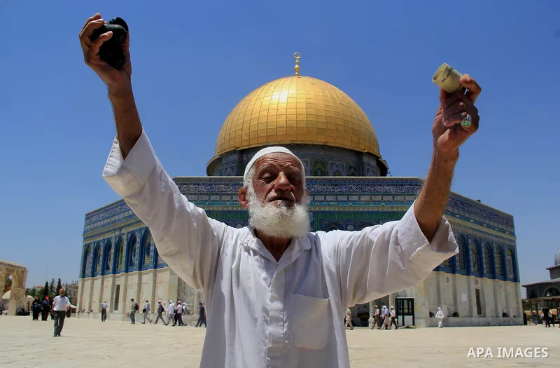 A Palestinian man shows foam-tipped bullets reportedly used by Israeli riot police outside the Dome of the Rock in Jerusalem's Al-Aqsa mosque compound after clashes erupted at the compound between Palestinians and Israel...