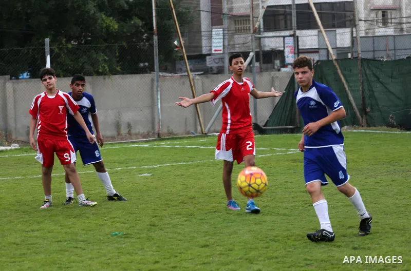 Palestinian orphan children play football match during al-Amal champion in Gaza city, on June 26, 2016 during the Muslim holy month of Ramadan. Ramadan is sacred to Muslims because it is during that month that tradition...
