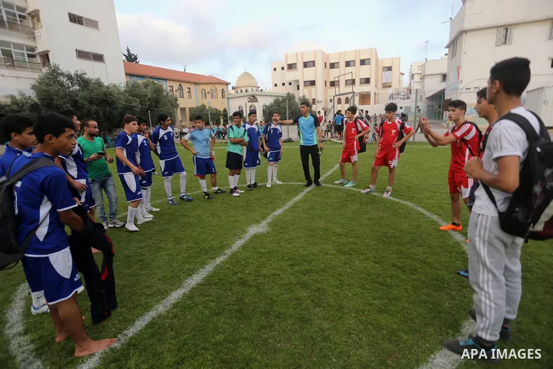 Palestinian orphan children play football match during al-Amal champion in Gaza city, on June 26, 2016 during the Muslim holy month of Ramadan. Ramadan is sacred to Muslims because it is during that month that tradition...