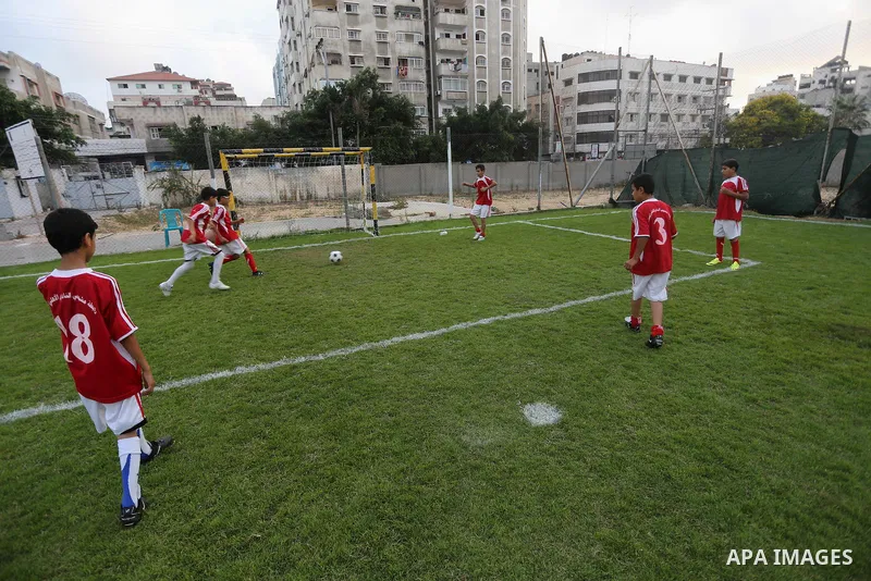 Palestinian orphan children play football match during al-Amal champion in Gaza city, on June 26, 2016 during the Muslim holy month of Ramadan. Ramadan is sacred to Muslims because it is during that month that tradition...