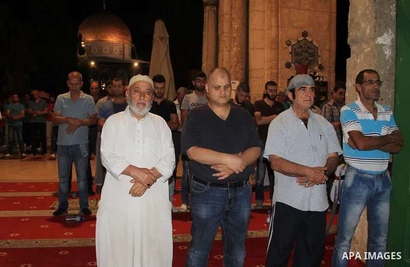 Palestinian Muslim worshippers perform "Taraweeh", nightly prayer of the month of Ramadan, inside al-Aqsa mosque, in Jerusalem's old city on June 26, 2016. Ramadan is sacred to Muslims because it is during that month tha...
