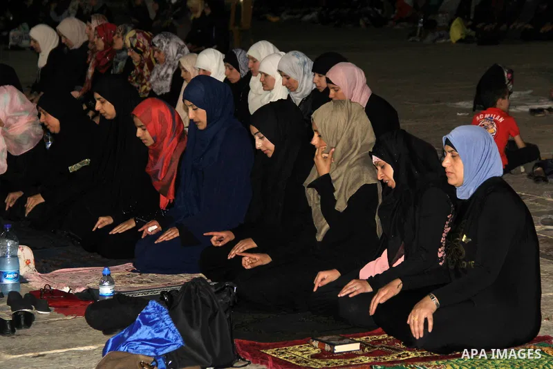 Palestinian Muslim worshippers perform "Taraweeh", nightly prayer of the month of Ramadan, in front of the Dome of the Rock mosque, in Jerusalem's old city on June 26, 2016. Ramadan is sacred to Muslims because it is dur...