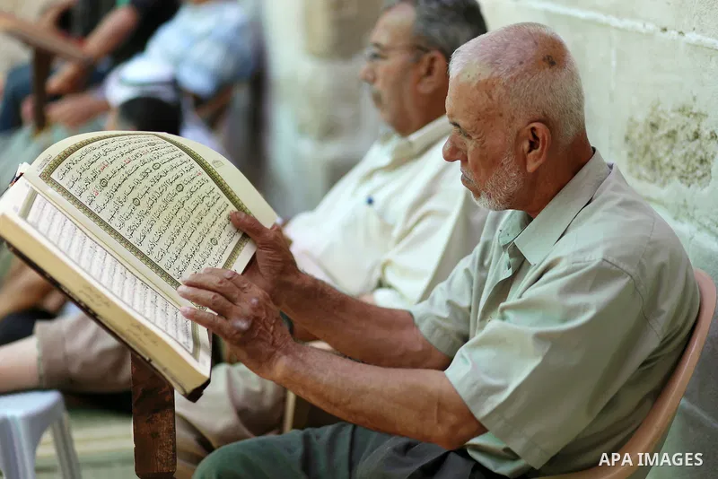 Palestinian Muslims read the Koran, Islam's holy book, at Sayed Hashim Mosque, during the Muslim holy month of Ramadan, in Gaza city on June 27, 2016. Ramadan is sacred to Muslims because it is during that month that tra...