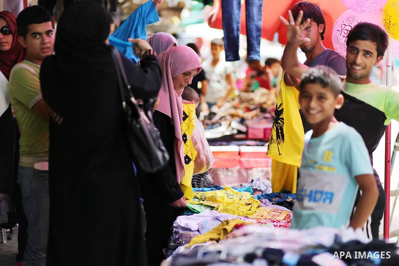 Palestinians shop at clothes market during the Muslim holy month of Ramadan, in Gaza city on June 27, 2016. Ramadan is sacred to Muslims because it is during that month that tradition says the Koran was revealed to the P...
