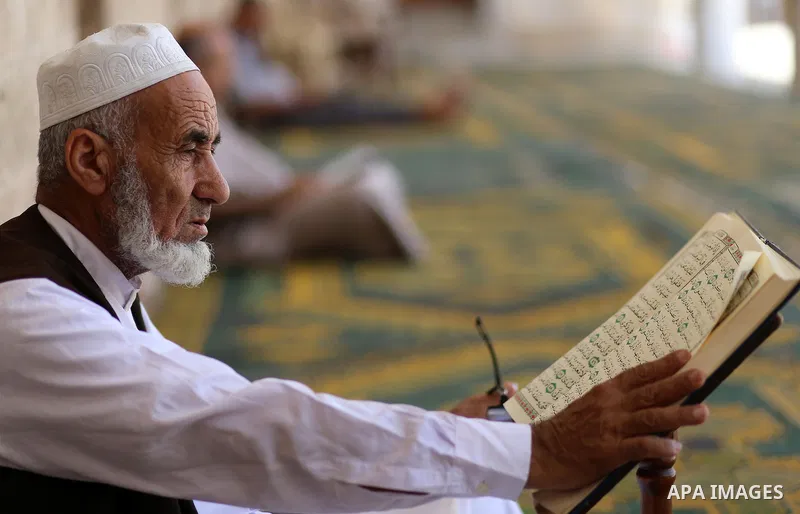 Palestinian Muslims read the Koran, Islam's holy book, at Sayed Hashim Mosque, during the Muslim holy month of Ramadan, in Gaza city on June 27, 2016. Ramadan is sacred to Muslims because it is during that month that tra...