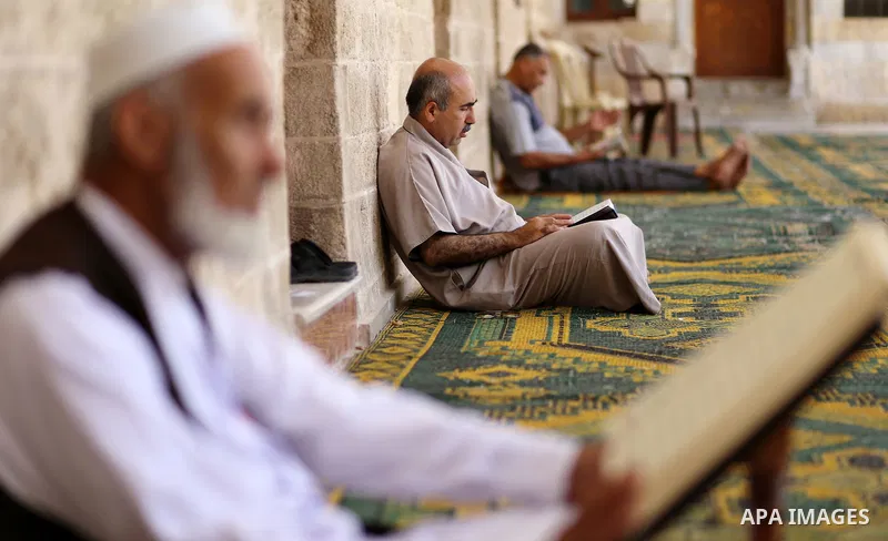 Palestinian Muslims read the Koran, Islam's holy book, at Sayed Hashim Mosque, during the Muslim holy month of Ramadan, in Gaza city on June 27, 2016. Ramadan is sacred to Muslims because it is during that month that tra...