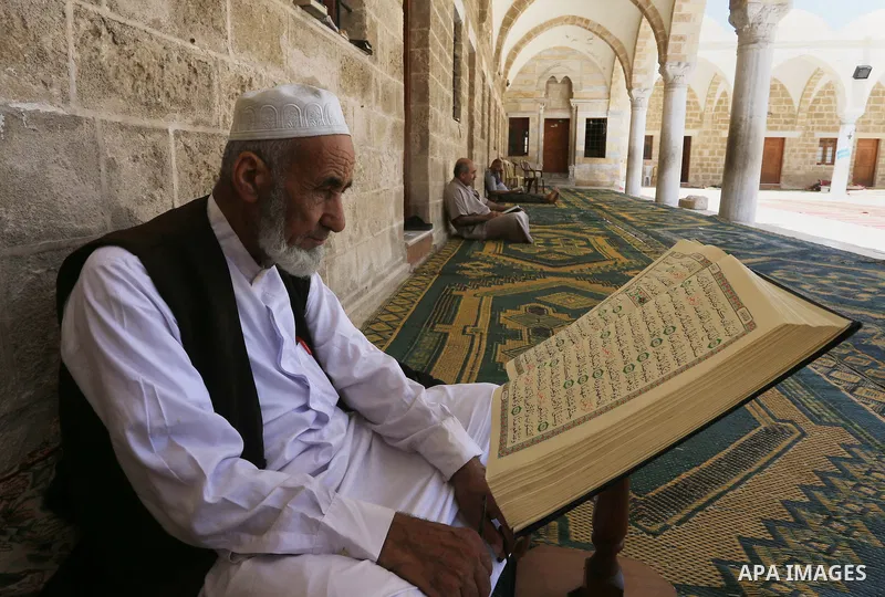 Palestinian Muslims read the Koran, Islam's holy book, at Sayed Hashim Mosque, during the Muslim holy month of Ramadan, in Gaza city on June 27, 2016. Ramadan is sacred to Muslims because it is during that month that tra...