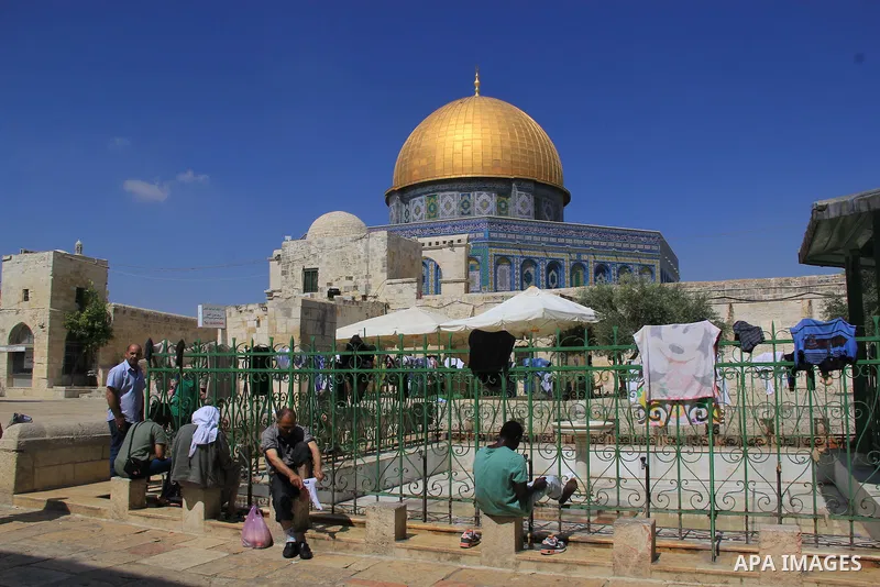 Palestinians clean their hands before prayers during the holy month of Ramadan near the Dome of the Rock on the compound known to Muslims as Noble Sanctuary and to Jews as Temple Mount in Jerusalem's old city, on June 28...