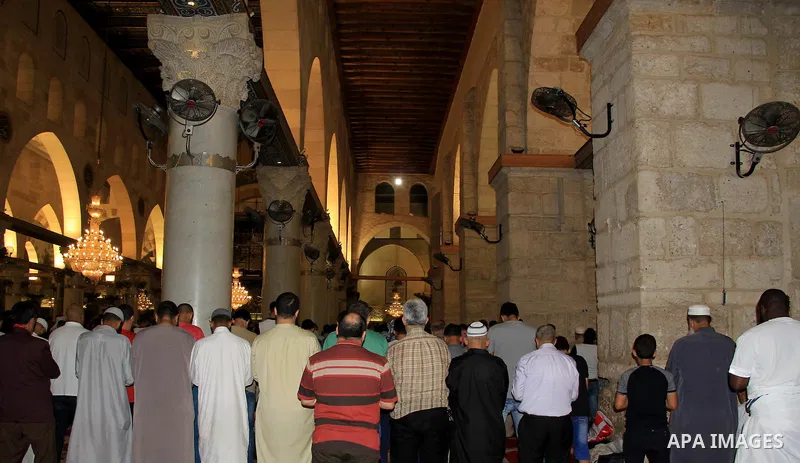 Palestinian Muslim worshippers perform "Taraweeh", nightly prayer of the month of Ramadan, in front of the Dome of the Rock mosque, in Jerusalem's old city on June 28, 2016. Ramadan is sacred to Muslims because it is dur...