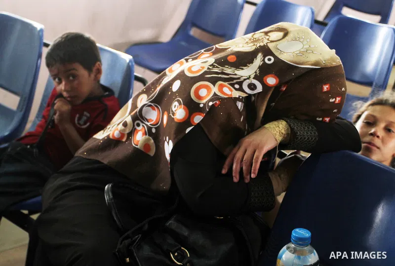 Palestinians wait for a travel permit to cross into Egypt through the Rafah border crossing after it was opened by Egyptian authorities for five days, in the southern Gaza Strip June 29, 2016. Photo by Abed Rahim Khatib