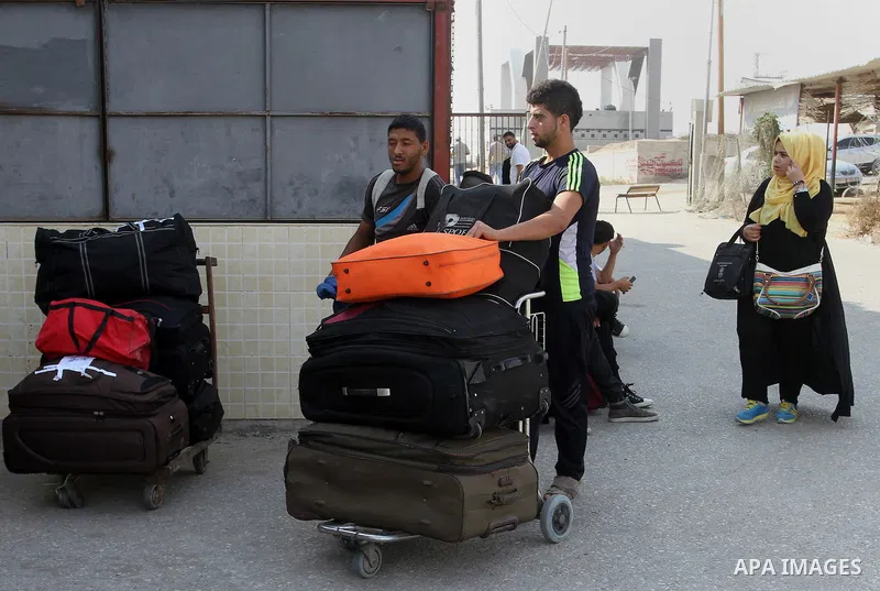 Palestinians wait for a travel permit to cross into Egypt through the Rafah border crossing after it was opened by Egyptian authorities for five days, in the southern Gaza Strip June 29, 2016. Photo by Abed Rahim Khatib