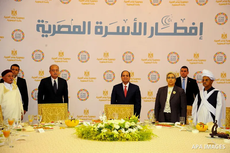 Egyptian President Abdel-Fattah al-Sisi takes part in the Egyptian family breakfast, during the Muslim holy month of Ramadan, in Cairo, on June 29, 2016. Photo by Egyptian President Office