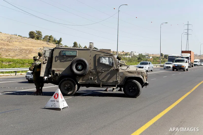 Israeli security forces gather near the scene of what the Israeli military said was an attack by Palestinian in the Jewish settlement of Kiryat Arba near the West Bank city of Hebron 30 June 2016. Israeli army said the P...