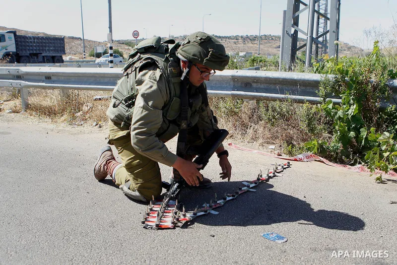 Israeli security forces gather near the scene of what the Israeli military said was an attack by Palestinian in the Jewish settlement of Kiryat Arba near the West Bank city of Hebron 30 June 2016. Israeli army said the P...