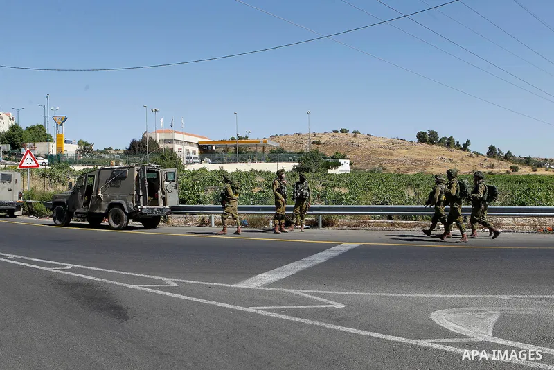 Israeli security forces gather near the scene of what the Israeli military said was an attack by Palestinian in the Jewish settlement of Kiryat Arba near the West Bank city of Hebron 30 June 2016. Israeli army said the P...