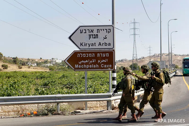 Israeli security forces gather near the scene of what the Israeli military said was an attack by Palestinian in the Jewish settlement of Kiryat Arba near the West Bank city of Hebron 30 June 2016. Israeli army said the P...